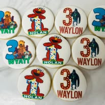 Iced cookies featuring Elmo, numbers, and names