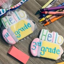 Pencil-shaped cookies that say Hello 1st grade and Hello 3rd grade
